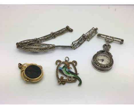 A gold bloodstone set fob, a silver and enamel pendant, .800 silver bracelet, a small marcasite nurses watch.