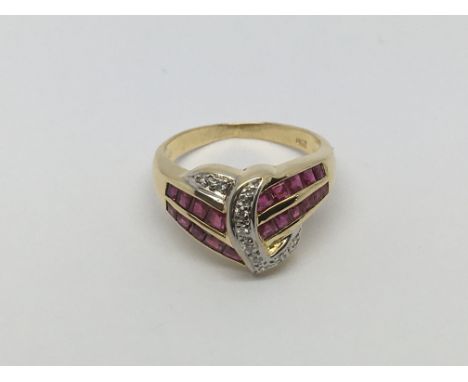 An 18ct gold ruby and diamond dress ring, approx 5.4g and approx size N.