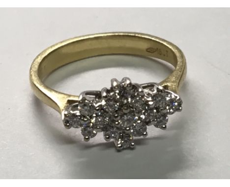 An 18carat gold ring set with a pattern of Brilliant cut diamonds.Ring Size K.