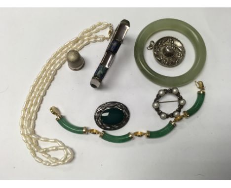 A double sting of pearls on a 14ct clasp, jade bangle, silver and lapis lazuli set bracelet plus additional jewellery items.