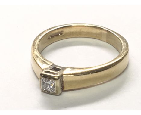A 9carat gold ring set with a solitaire princess cut diamond 0.15 of a carat. Ring size K-L