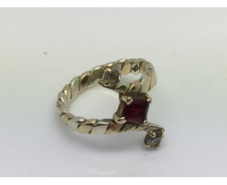 A 9ct ruby and diamond set 2 tone gold ring. Approx 3.5. (K).