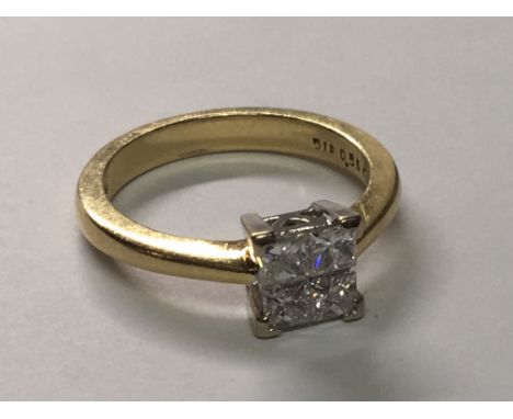 An 18carat gold ring set with four princess cut diamond approximately 0.50 of a carat ring size K-L