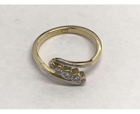 An 18ct gold ring set with five diamonds in a diagonal setting, approx.15ct, 3.6g and approx size O.