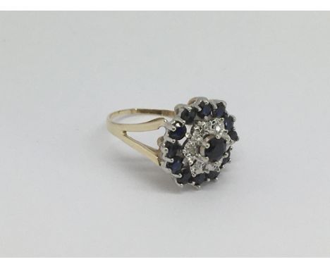 A 9ct gold cluster ring set with diamonds and sapphires, approx 3.7g and approx size K.