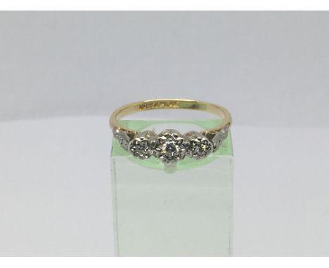 A circa 1930s 18ct gold and platinum three stone diamond ring, approx 3.5g and approx size P-Q.