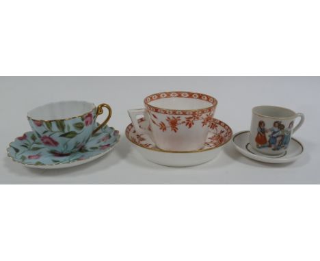 NINETEENTH CENTURY MINTON PORCELAIN TEACUPS AND SAUCER, with brick red Japanesque floral printed decoration, impressed 'Minto