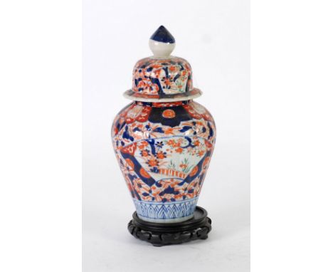 JAPANESE IMARI FLUTED BALUSTER VASE AND COVER, with blue finial, 12" (30.5cm) high