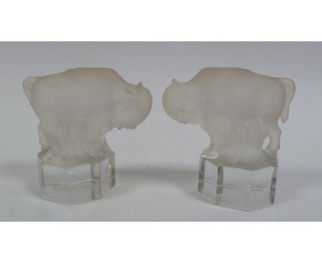 PAIR OF MODERN GOEBEL FROSTED GLASS MODELS OF BUFFALOS on octagonal clear bases, 3 1/2" (8.9cm) high, TOGETHER WITH A SIMILAR
