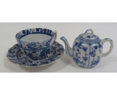 NINETEENTH CENTURY CONTINENTAL BLUE AND WHITE PORCELAIN MINIATURE TEAPOT, painted with 'Onion' pattern, capital 'T' and dot m