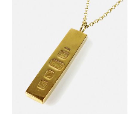 A 9ct gold ingot pendant, with attached yellow metal chain, stamped '9ct', the ingot hallmarked London 1977, total weight 35.