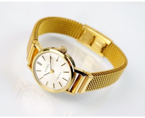 A lady's gold plated Omega wristwatch, the plain silvered dial with batons, manual wind, with attached gold plated expanding 