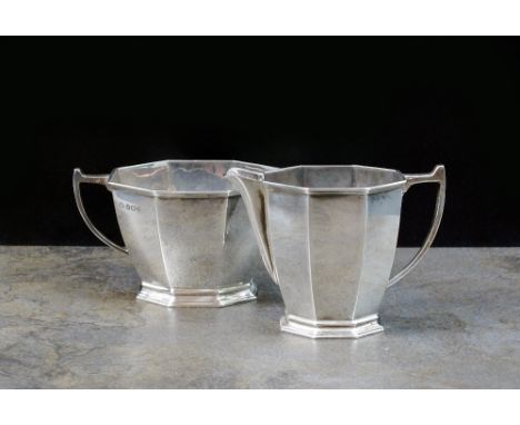 An Art Deco silver sugar bowl and cream jug, Adie Brothers Ltd, Birmingham 1937, each of faceted form, total weight 6.4oz (2)