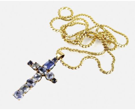 A graduated sapphire set cross pendant, suspended from yellow metal chain, the bolt ring clasp stamped '750', total weight 14