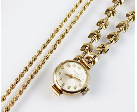 A lady's 9ct gold Enicar bracelet wristwatch, the circular silvered dial with gold Arabic numerals, manual wind and with atta