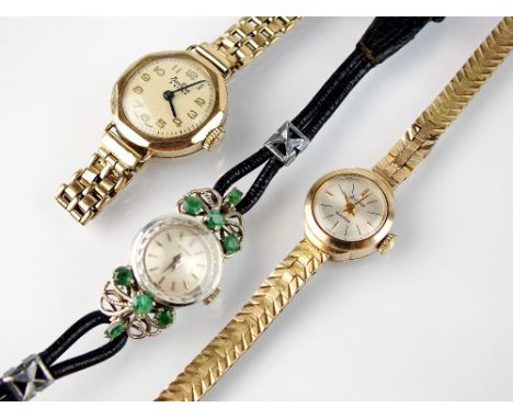 A lady's 9ct white gold and emerald set Eterna wristwatch, the circular silvered dial with batons, manual wind, four emeralds