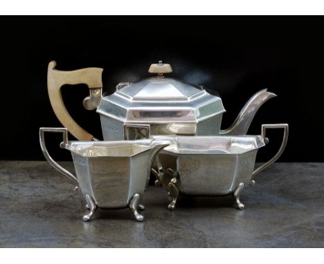 An Art Deco three piece silver tea service, Emile Viner, Sheffield 1938, each piece of octagonal form, comprising; a teapot w