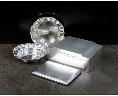 An Art Deco silver cigarette box, Walker & Hall, Sheffield 1932, of rectangular form with stepped engine turned cover, togeth