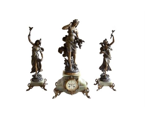 A VICTORIAN SPELTER CLOCK GARNITURE