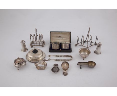 A COLLECTION OF SILVER TABLEWARE, comprising:- a Victorian five bar silver toast rack, London 1898, each bar cast in the shap