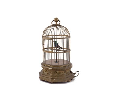 A LATE 19TH CENTURY CONTINENTAL GILTWOOD AND GILDED METAL CIRCULAR DOME TOP SINGING BIRD AUTOMATON, with single exotic bird a