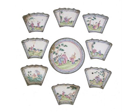 A CHINESE CANTON ENAMEL HORS D'OEUVRE DISH of circular form, the centre dish painted with scholars in an open landscape encir