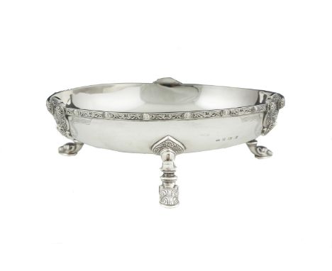 A LARGE CELTIC PATTERN CIRCULAR SILVER FRUIT BOWL, Birmingham 1947, with decorated rim and raised on scroll and serpent head 