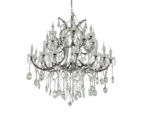 A LARGE FRENCH BRASS FRAMED AND GLASS TWO-TIER CHANDELIER, with thirty branches, the candle lamps with circular drip pans and