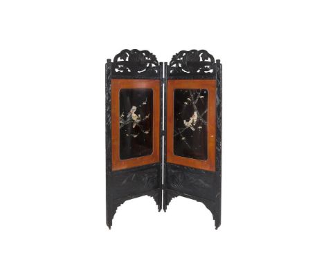 A JAPANESE EBONISED TWO FOLD SCREEN with inset panels lacquered and with mother of pearl inlaid decorative scenes depicting b