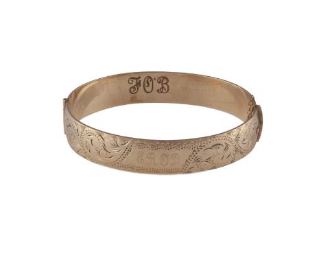 A GOLD PLATED HINGED BANGLE, inscriptions E.R.O.B on front and FOB inside