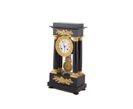 A FRENCH EMPIRE STYLE TEMPLE CLOCK, the ebonised timber case with ormolu mounts, with striking movement, having a silvered di