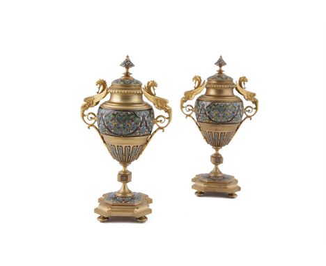 A PAIR OF FRENCH GILT METAL AND ENAMEL CASSOLETTES, each with domed covers and pointed finials, over an ovoid body applied wi