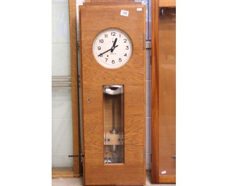 Mid century Oak Cased ' Inducta ' Electric Clock, the 8.5" dial with seconds dial, with pendulum, 103cm high