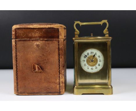 A French made brass cased carriage clock with bevelled glass panels, repeater function button to top, marked for R &amp; Co o