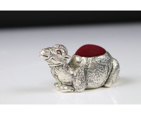 Silver pincushion in the form of a camel with ruby eyes 