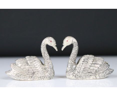 Pair of silver plated condiments in the form of swans with ruby eyes 