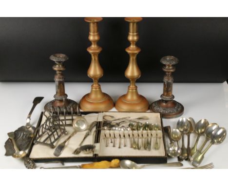 A collection of mixed silver plate to include toast racks, cake slice, cutlery...etc.. together with a hallmarked silver suga