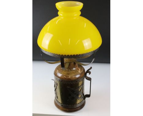 Table Lamp, the metal wood effect base covered with a brass and white metal band, holding yellow glass oil lamp type shade, 5