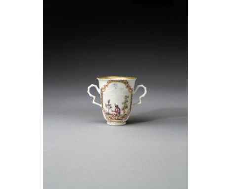 A rare early Meissen beaker, circa 1722-23Of slender, flared form with faceted, ear-shaped handles, each side painted with a 