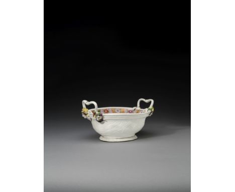 A Meissen oval basket, circa 1735Probably modelled by J.J. Kaendler, the exterior moulded with a basketwork pattern, applied 