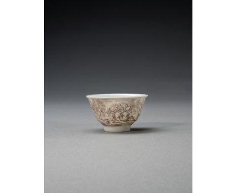 A small Chinese porcelain teabowl decorated by Ignaz Bottengruber, circa 1730Painted in manganese and shaded in yellow with a