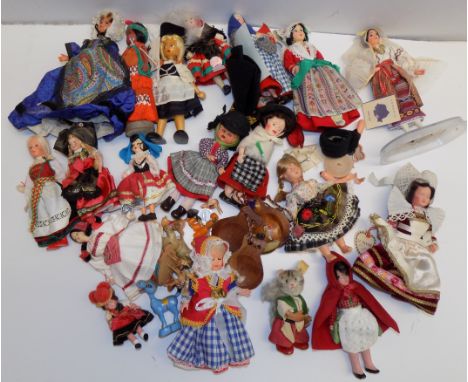 A collection of costume dolls to include a Steiff cat.