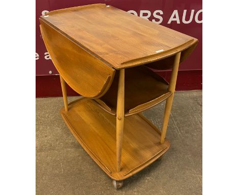 An Ercol Blonde elm and beech Windsor drop leaf trolley 