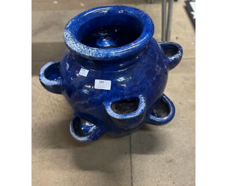 A cobalt blue glazed strawberry planter 