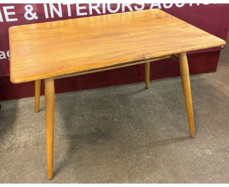 An Ercol Blonde elm and beech 393 model low breakfast table 