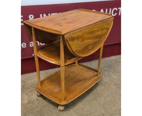 An Ercol elm and beech Windsor drop leaf trolley 