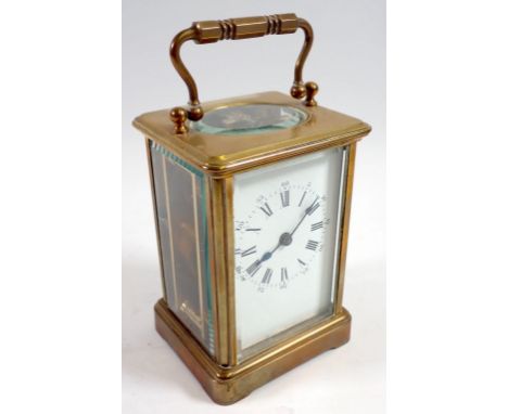 A brass carriage clock, 11cm tall, rear glass panel a/f