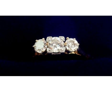 An 18 carat gold and platinum set three stone diamond ring, size K, 2.4g