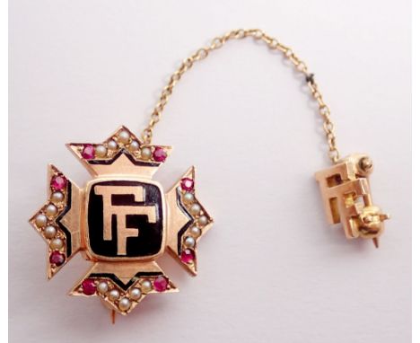 A 9 carat gold pin brooch enamelled 'FF' with ruby and seed pearl set sides and safety 'FF' pin, 2.5g