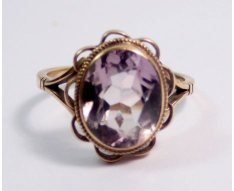 A 9 carat gold oval cut amethyst ring, size J to K, 2.5g